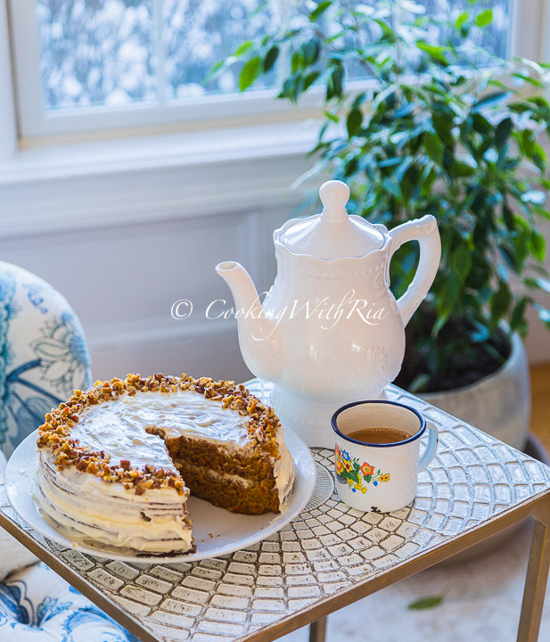 masala chai in an enamel cup with carrot cake