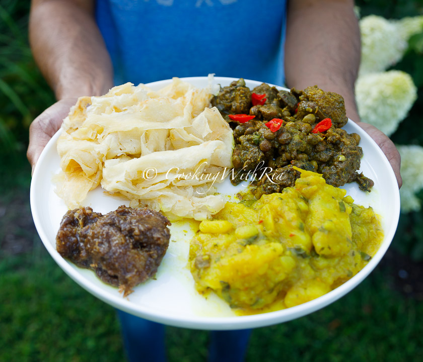 Curry duck with pigeon peas, curry aloo, paratha