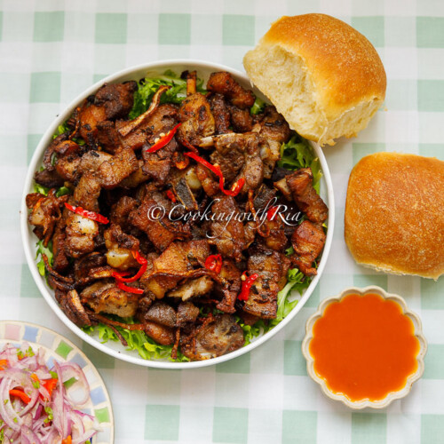 Trinidad Garlic Pork Served with Hops Bread, Pepper Sauce and Spicy Chip Up Lime Pickle