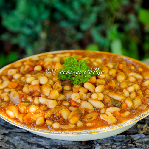 Caribbean Stewed Cannellini Beans served in a bowl and garnished with fresh parsley