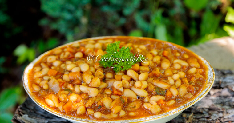 Caribbean Stewed Cannellini Beans served in a bowl and garnished with fresh parsley