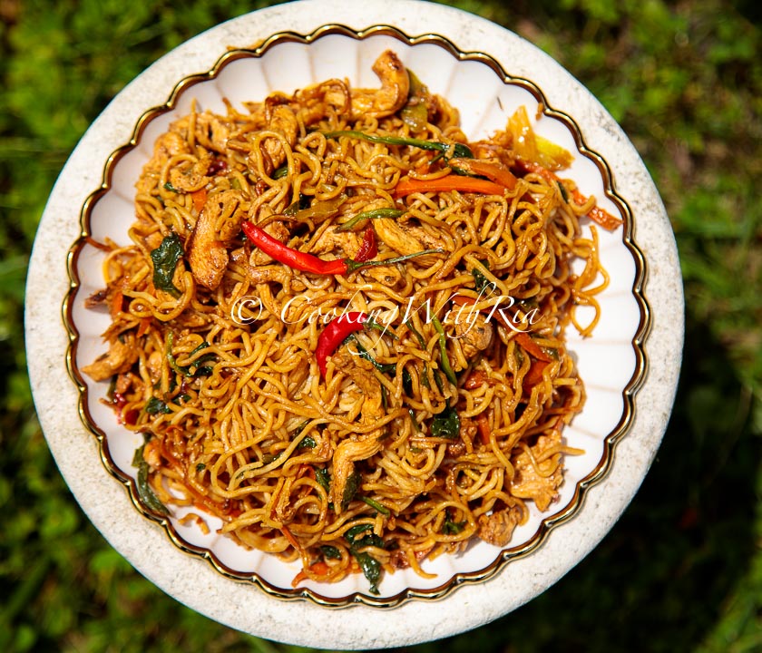 Easy Spicy Chow Mein Recipe served with chicken, spinach, carrots, scallions, and hot peppers