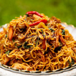 Close-up of homemade Easy Spicy Chow Mein Recipe with chewy noodles and fresh vegetables